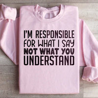 Light pink sweatshirt featuring bold white lettering: 'I'm Responsible For What I Say Not What You Understand'.