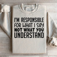 Sand-colored sweatshirt displaying bold white text: 'I'm Responsible For What I Say Not What You Understand'.
