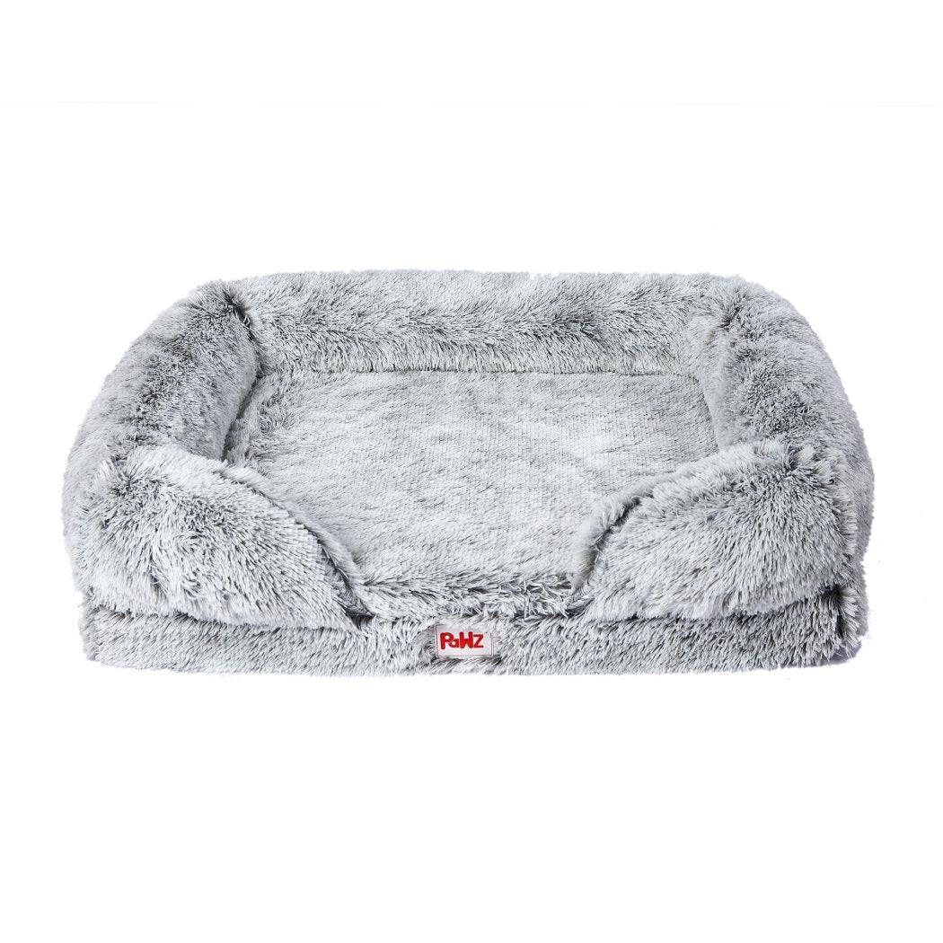 Close-up of plush pet bed's memory foam mattress showing soft texture