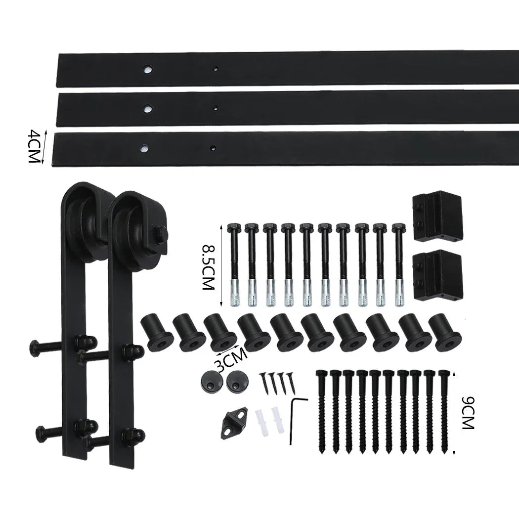 Close-up showing detailed metal rollers and track of vintage-style barn door hardware.
