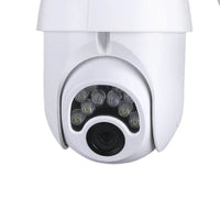 Wireless security camera setup showing camera and mobile phone monitoring live feed.