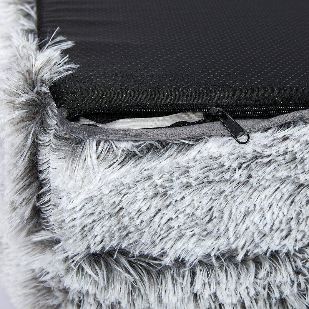 Side angle of cozy dog bed with cushioned border against white background