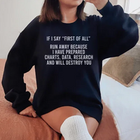 Black fleece sweatshirt showing 'If I Say First Of All Run Away' text on front, cozy fleece material.