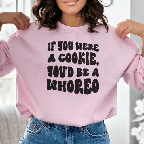 Close-up of peach sweatshirt fabric and printed text with warm fleece lining visible.