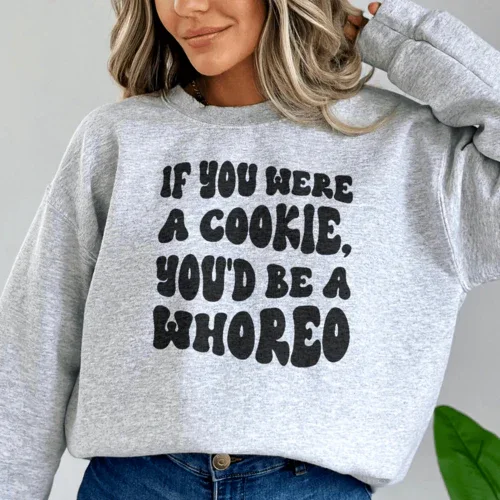 Peach sweatshirt displayed flat showing full front text design and crew neckline.