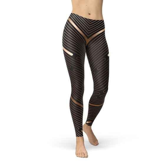 Front view of women's brown leggings with horizontal white stripes, full length, on plain background