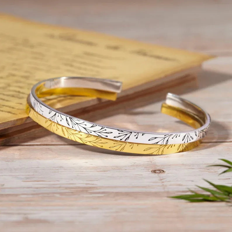 Close-up of the sterling silver bridesmaid bracelet showing delicate engraving details.