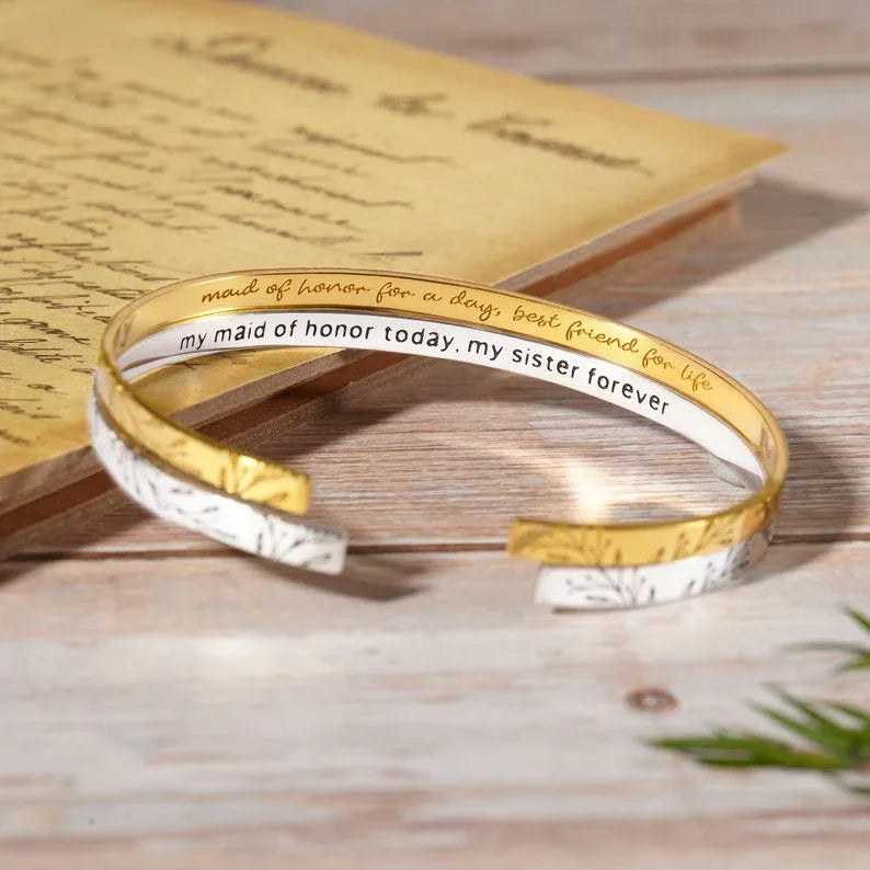 Sterling silver cuff bracelet engraved with a fixed message on the outside and custom inside engraving example.