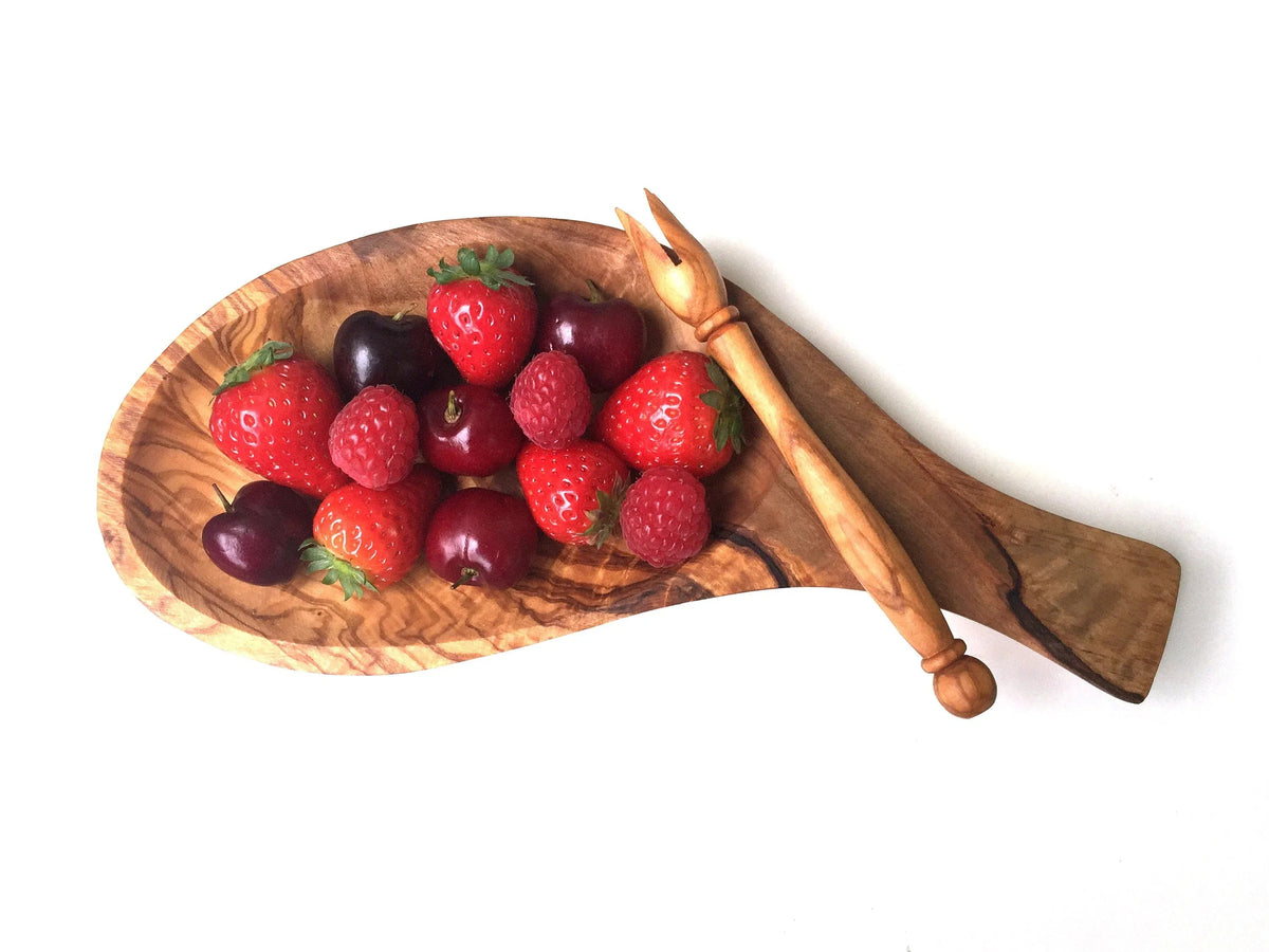 Rectangular serving platter with integrated handles and skewers on wooden surface.
