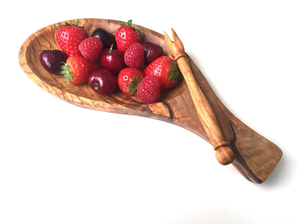 Overhead view of the empty serving platter showing compartments and attached skewers.