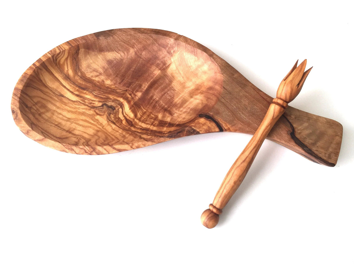 Serving platter with skewers displaying appetizers on a light background.