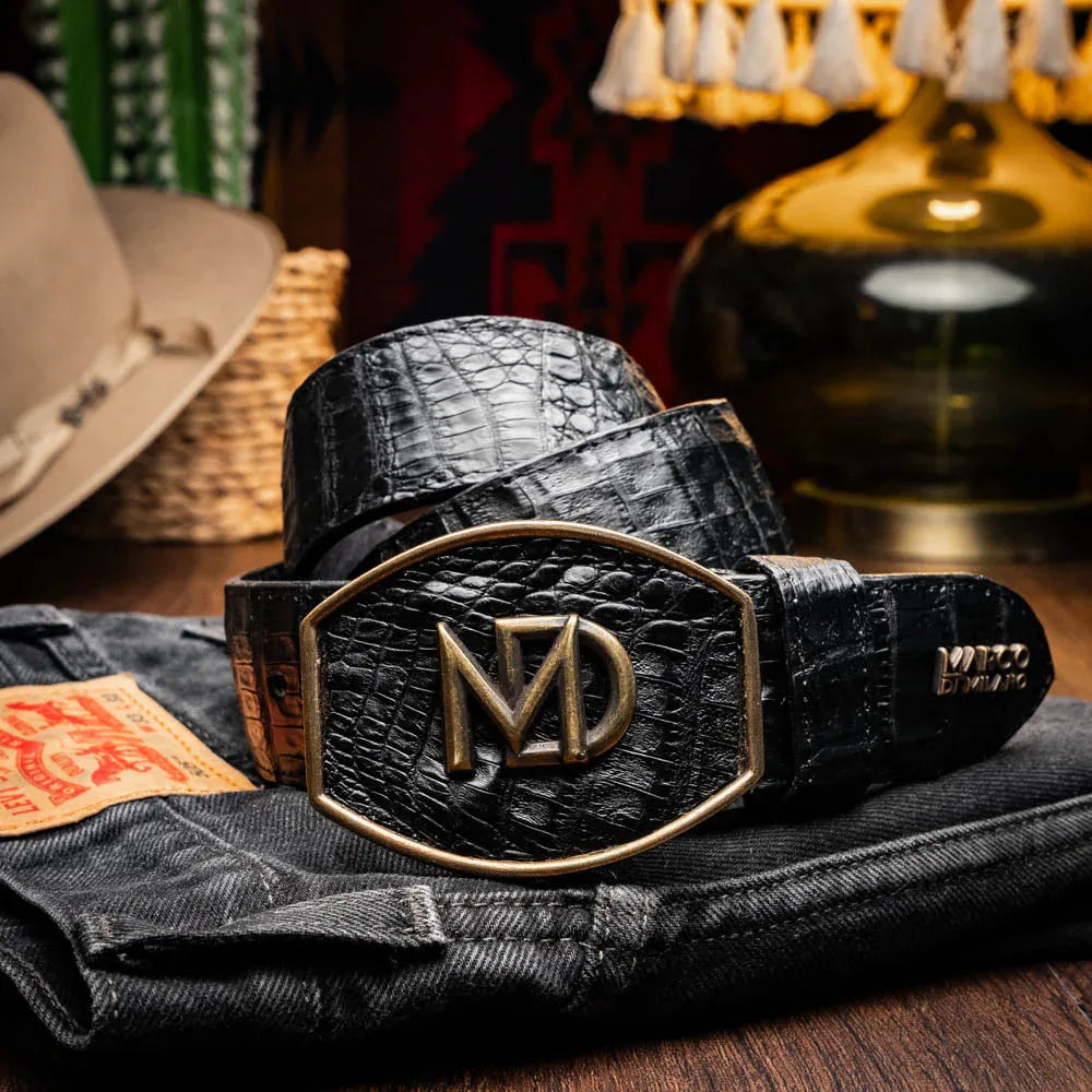 Model wearing black caiman crocodile belt with jeans, styled outdoors