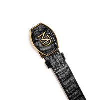 Side angle of black caiman crocodile belt highlighting texture and buckle details