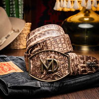 Model wearing stone brown Iowa caiman crocodile belt with western design and jeans outdoors.