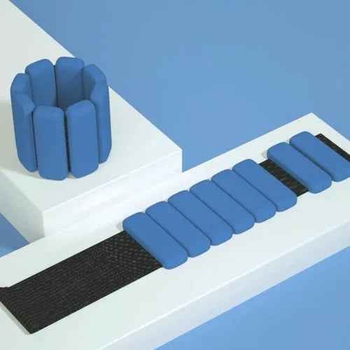 Pair of adjustable gray wrist or ankle weights with Velcro straps, designed for fitness activities and workouts.