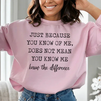 Peach colored sweatshirt featuring bold white text 'Just Because You Know Me Does Not Mean You Know Me'.