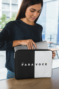 Black and white color block laptop sleeve with a modern design, displayed on a plain background.