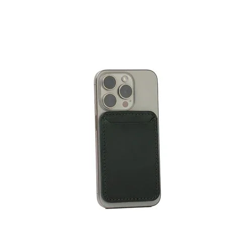 Forest green handcrafted leather MagSafe wallet for iPhone resting on white surface.