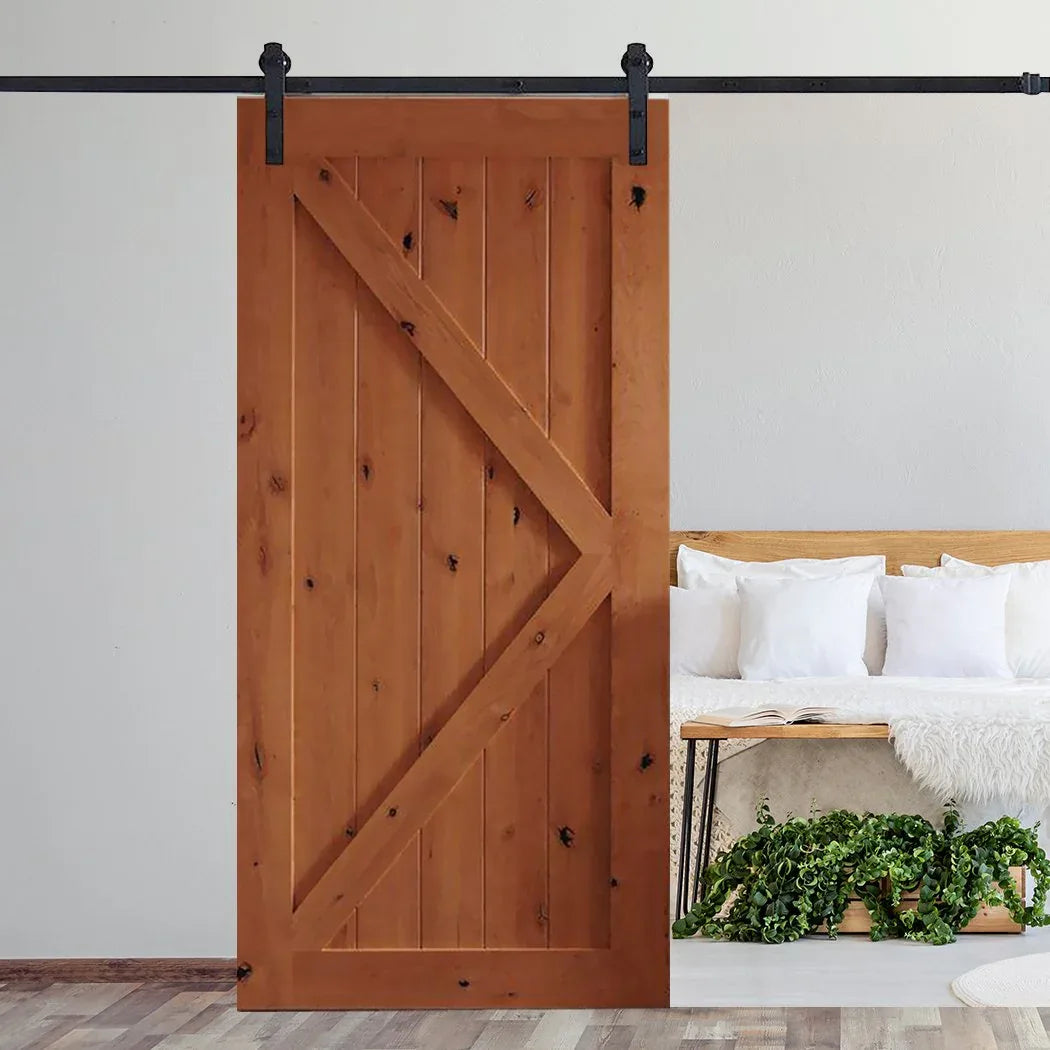 Stylish modern living room featuring white double sliding barn doors with antique hardware.