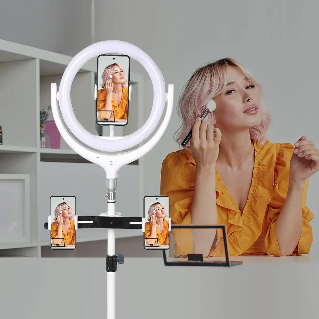 Lifestyle image showing an influencer recording video with LED ring light and phone holder setup.