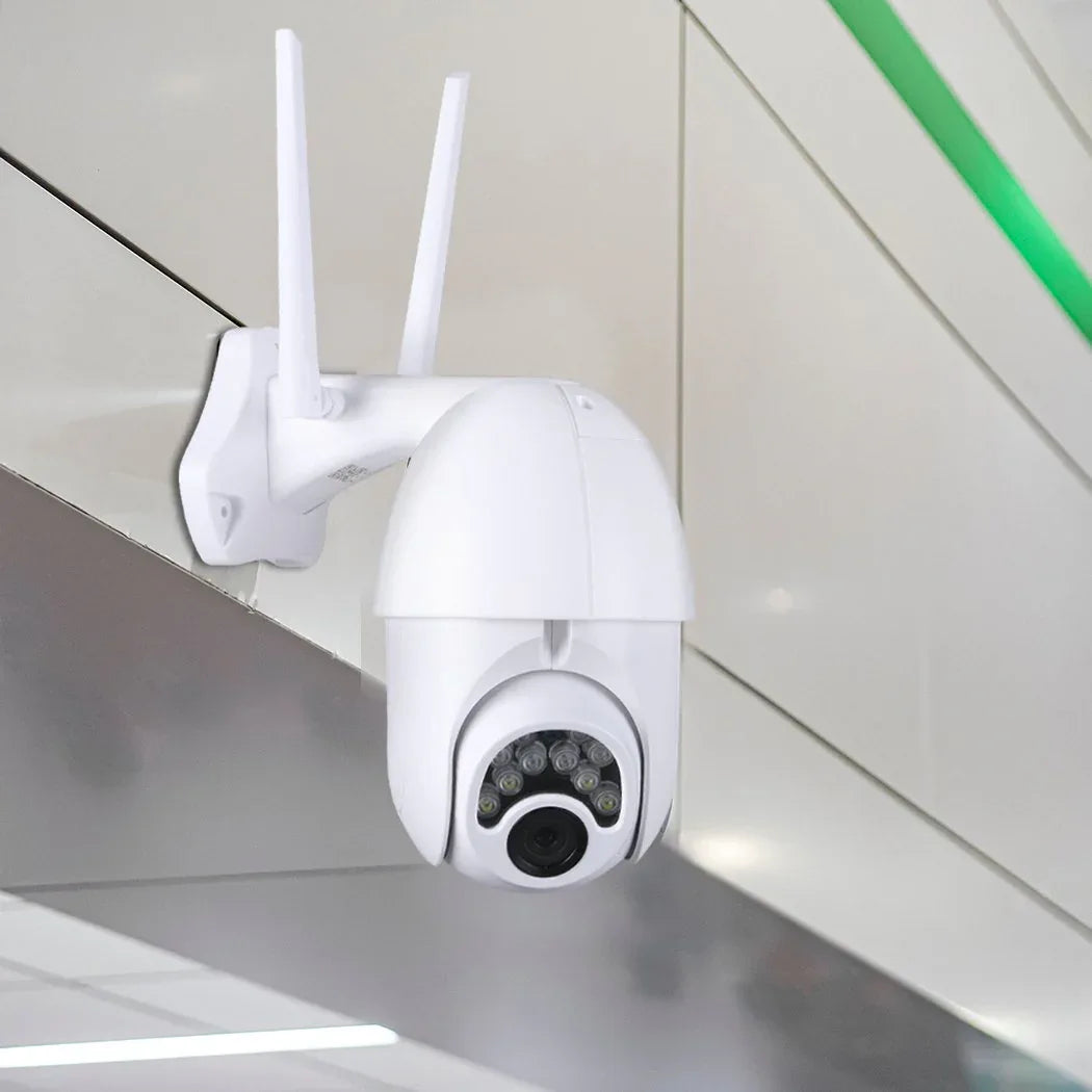 Hands holding smartphone showing live footage from wireless outdoor security camera.