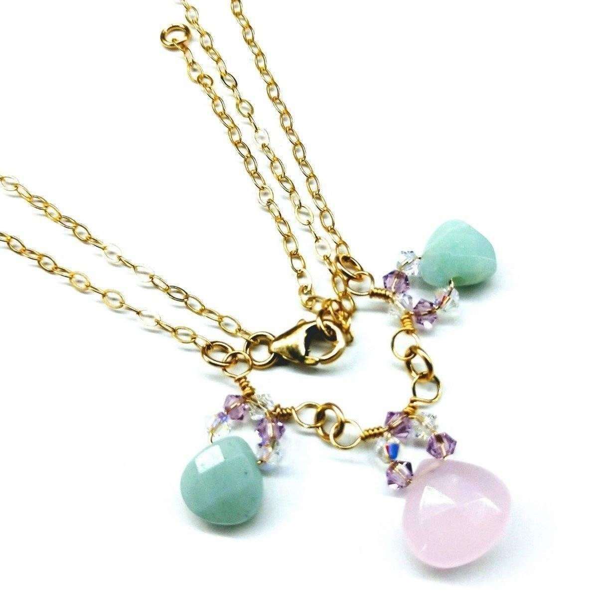 Close-up of light pink chalcedony and mint green amazonite gemstones on a 14 K gold filled necklace