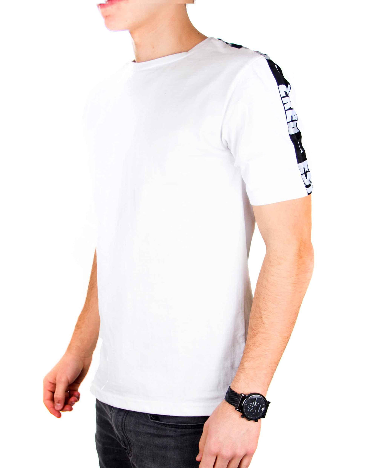 Side view of white ZRED Origin shirt showing fit and fabric texture on male model.
