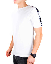 Side view of white ZRED Origin shirt showing fit and fabric texture on male model.
