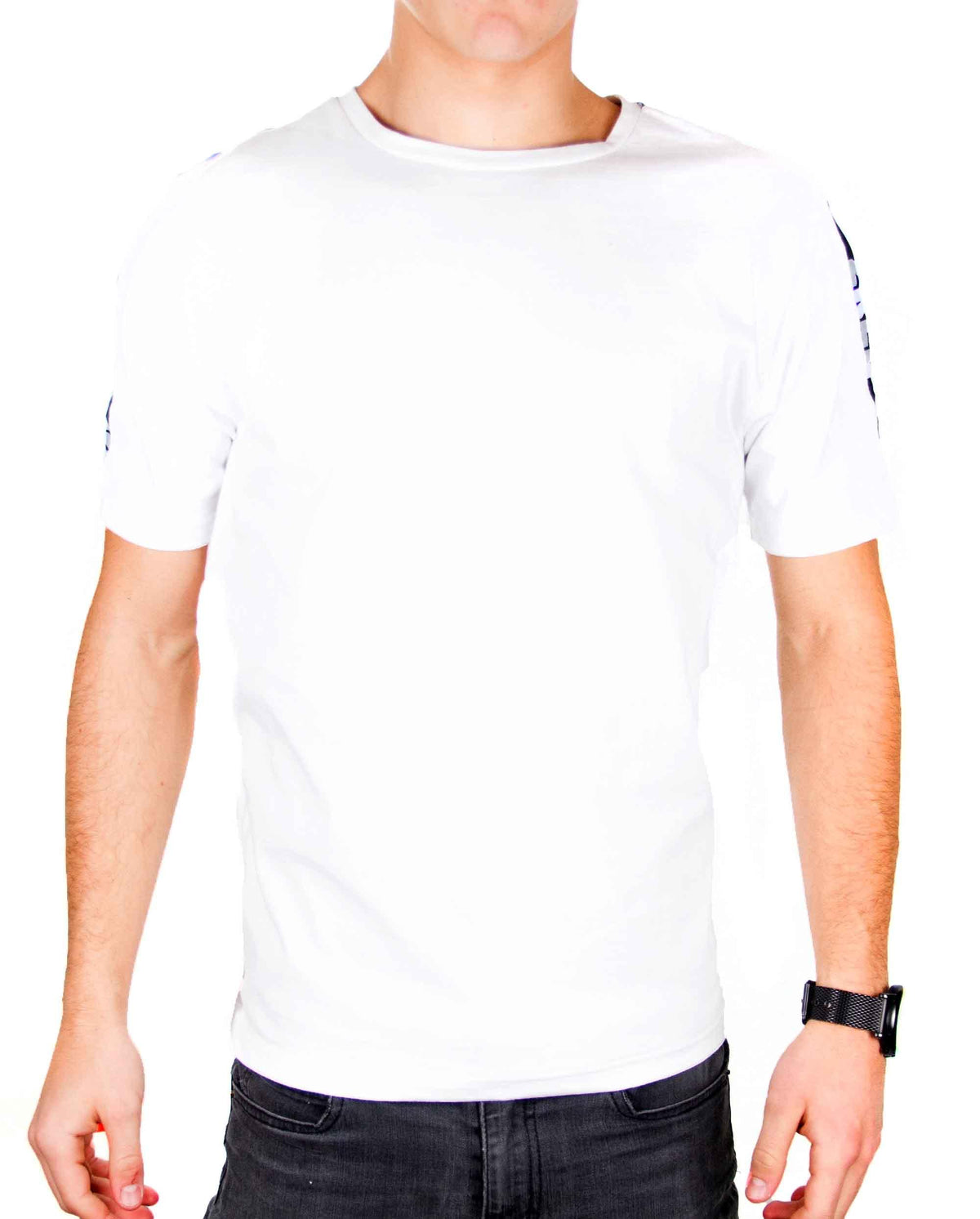 Front view of white ZRED Origin shirt with embroidered emblem worn by male model.