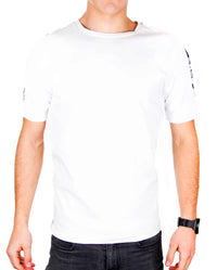 Front view of white ZRED Origin shirt with embroidered emblem worn by male model.