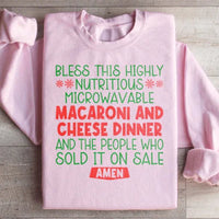 Light pink sweatshirt with vibrant macaroni and cheese dinner design on front.