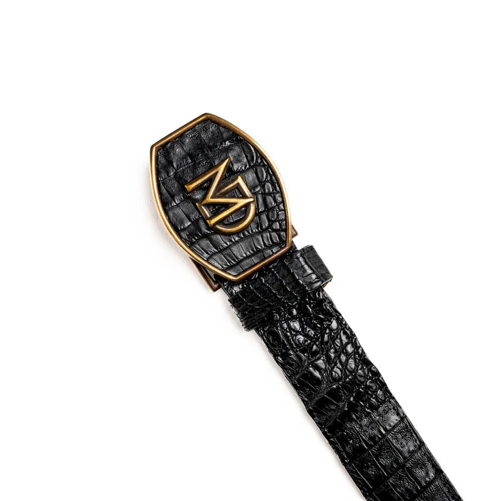 Side view of Marlboro black belt highlighting raised hornback caiman scales and polished antique brass buckle.