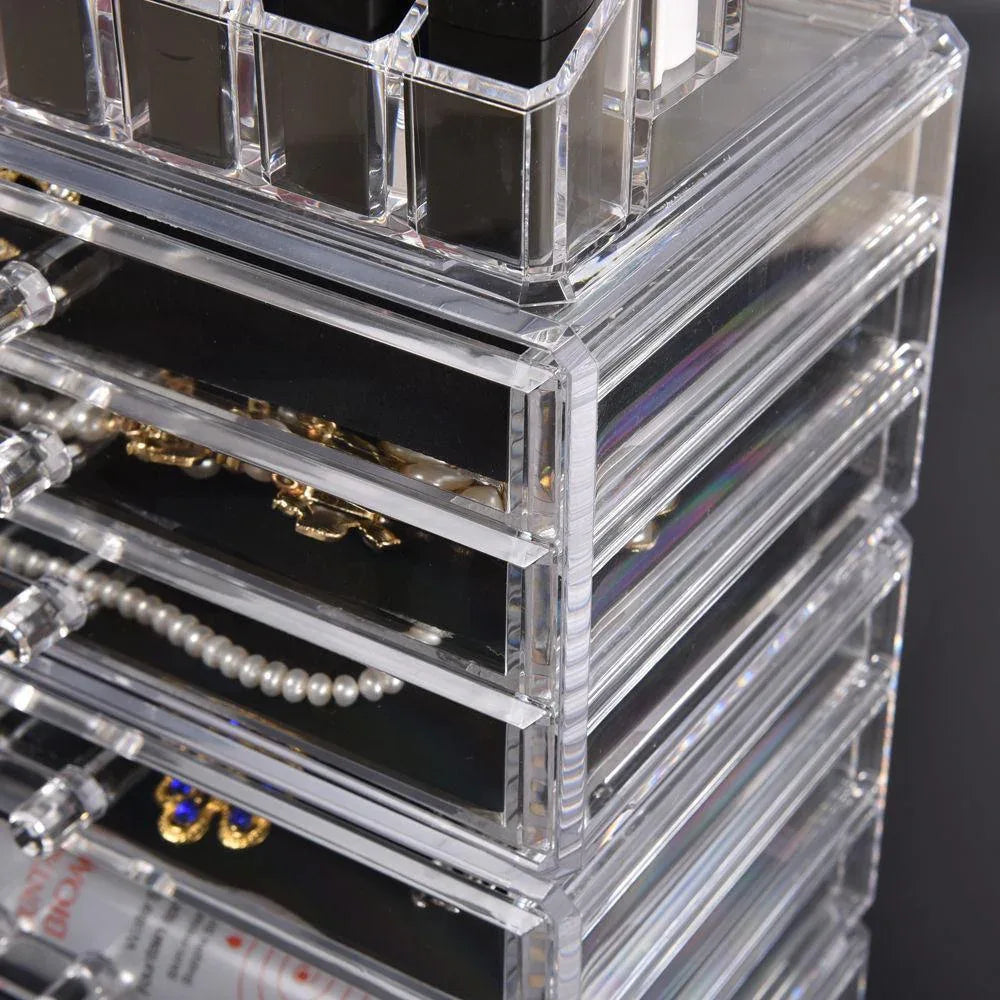 Top view of clear acrylic organizer displaying perfumes and brushes