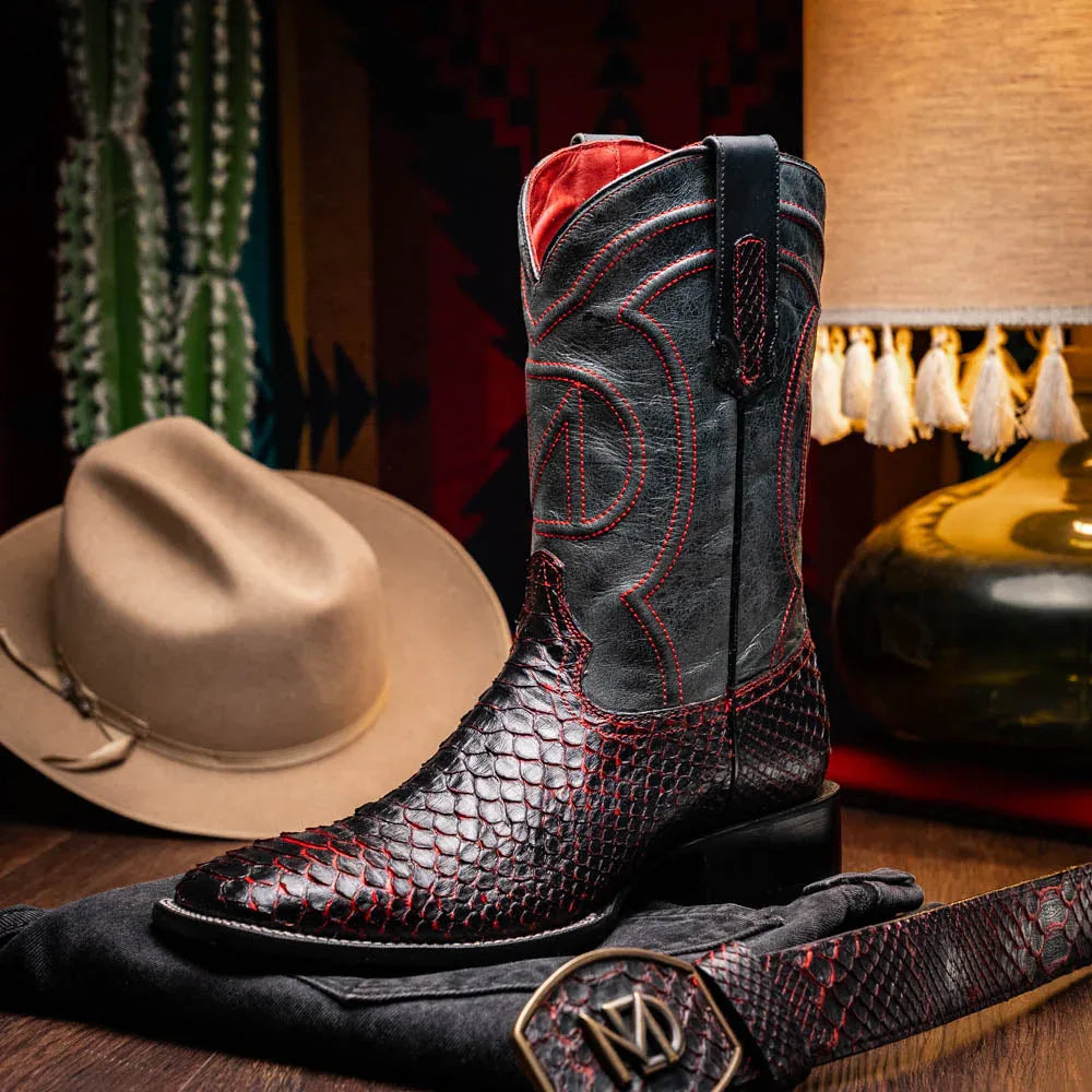 Person wearing Missouri BlackCherry cowboy boots outdoors on wooden decking.