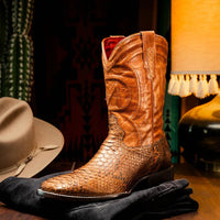 Lifestyle shot of Missouri cognac cowboy boots paired with casual outfit on wooden porch.