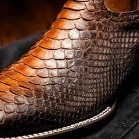 Woman walking wearing Missouri Lisboa cowboy boots, pairing classic Western style with modern square toe design.
