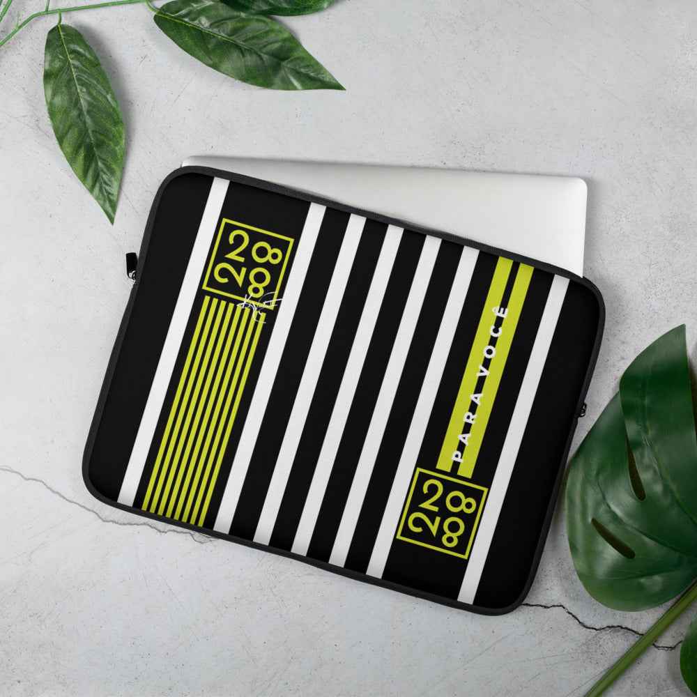 Colorful multi-stripe laptop sleeve lying flat on a white surface, showing its protective padded design.
