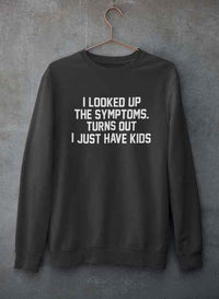 Gray crewneck sweatshirt hanging on wall, featuring printed text about kids causing symptoms.
