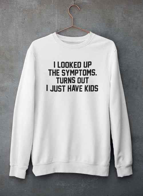 Close-up of gray sweatshirt with humorous kids-related text printed on front, hanging against wall.