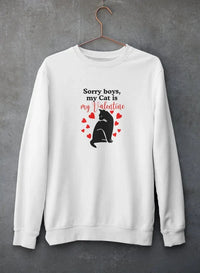 Grey sweatshirt hanging against concrete wall featuring 'Sorry Boys My Cat Is My Valentine' text and cat graphic design.