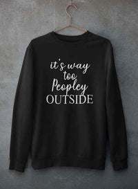 It's Way Too Peopley Outside Sweat Shirt hanging on a hanger against a gray concrete wall.
