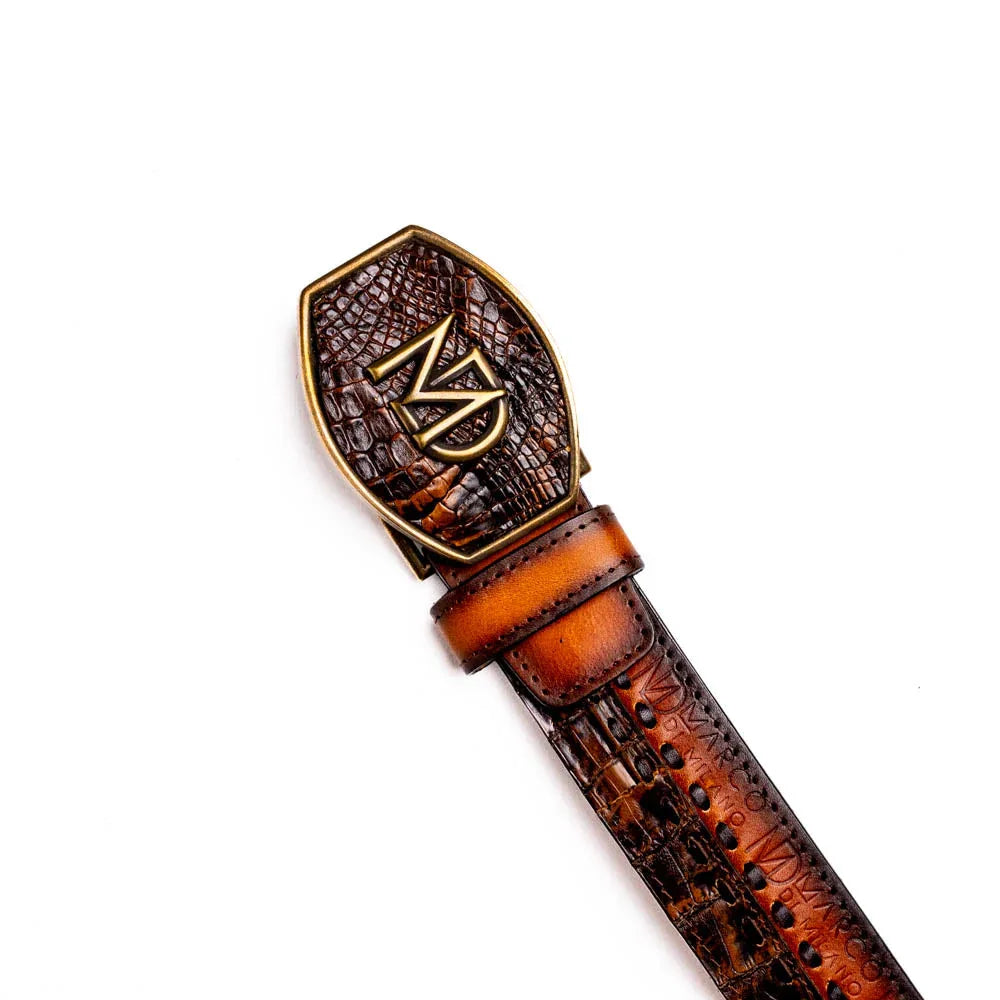 Montana Belt laid flat highlighting antique brass buckle and matching tip with rich brown leather layers.