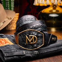 Lifestyle image of person wearing the Montana belt with dark jeans and casual shirt outdoors.