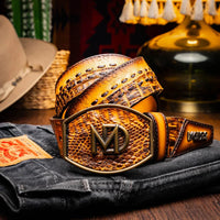Lifestyle image of person wearing Montana Belt mustard brown with denim jeans.