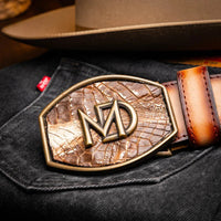 Montana belt styled with brown leather accessories in outdoor lifestyle setting