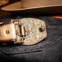 Styled photo of Montana belt with hand-stitched center detail worn over casual denim wear.