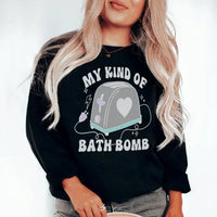 Close-up of black sweatshirt showing My Kind Of Bath Bomb artwork with vibrant colors on front