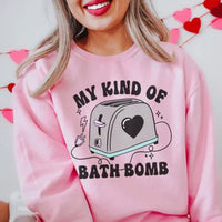 Light pink sweatshirt displaying My Kind Of Bath Bomb graphic in multi-color text across the front