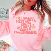 Light pink sweatshirt with bold black text that reads 'My Parents Didn't Raise A Quitter' across the chest.