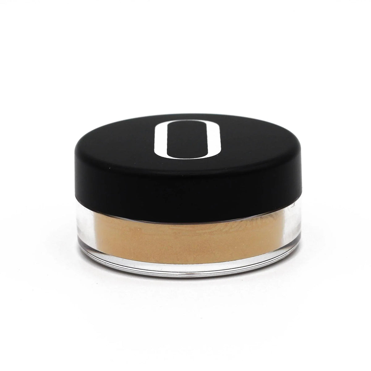 Gold highlighter powder texture with soft light reflections